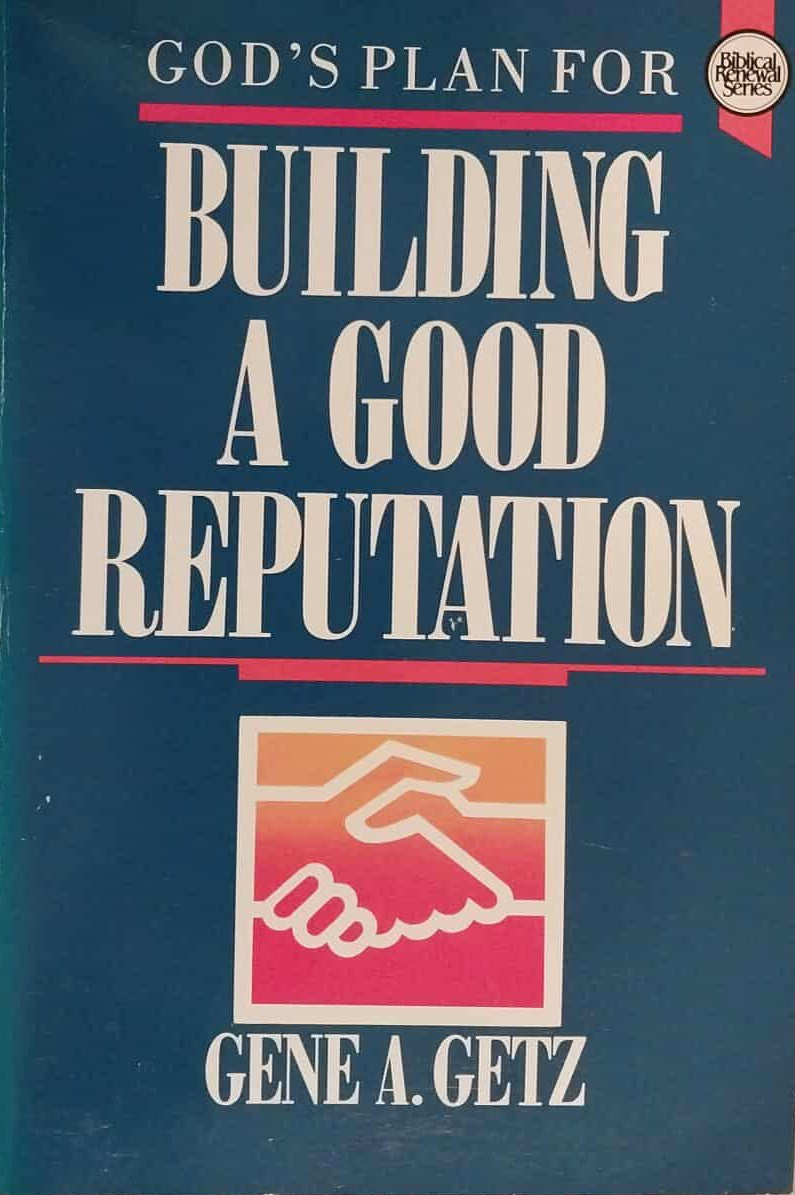 Book titled 'God's Plan for Building a Good Reputation' by Gene A. Getz on a dark surface.