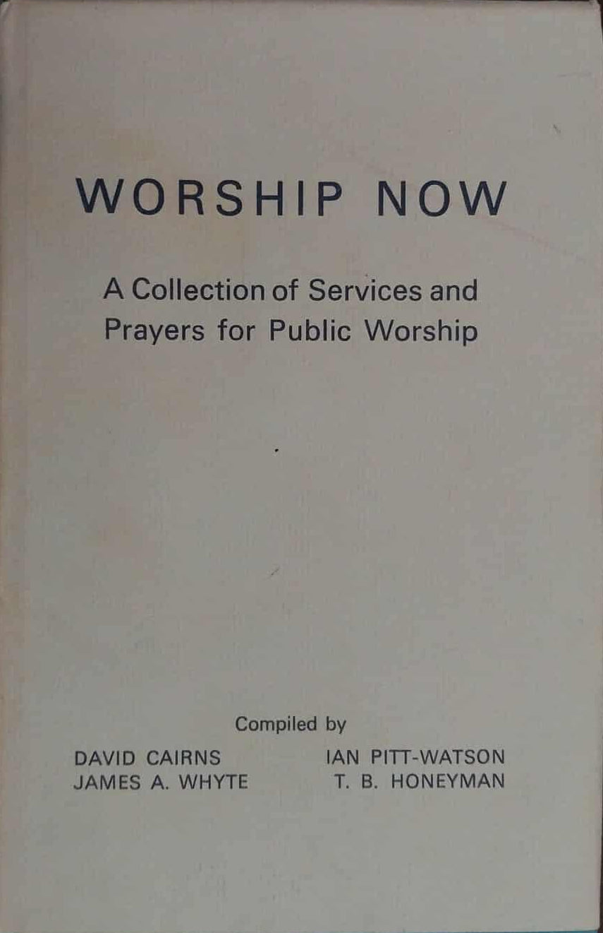 Book titled 'Worship Now' on a dark surface
