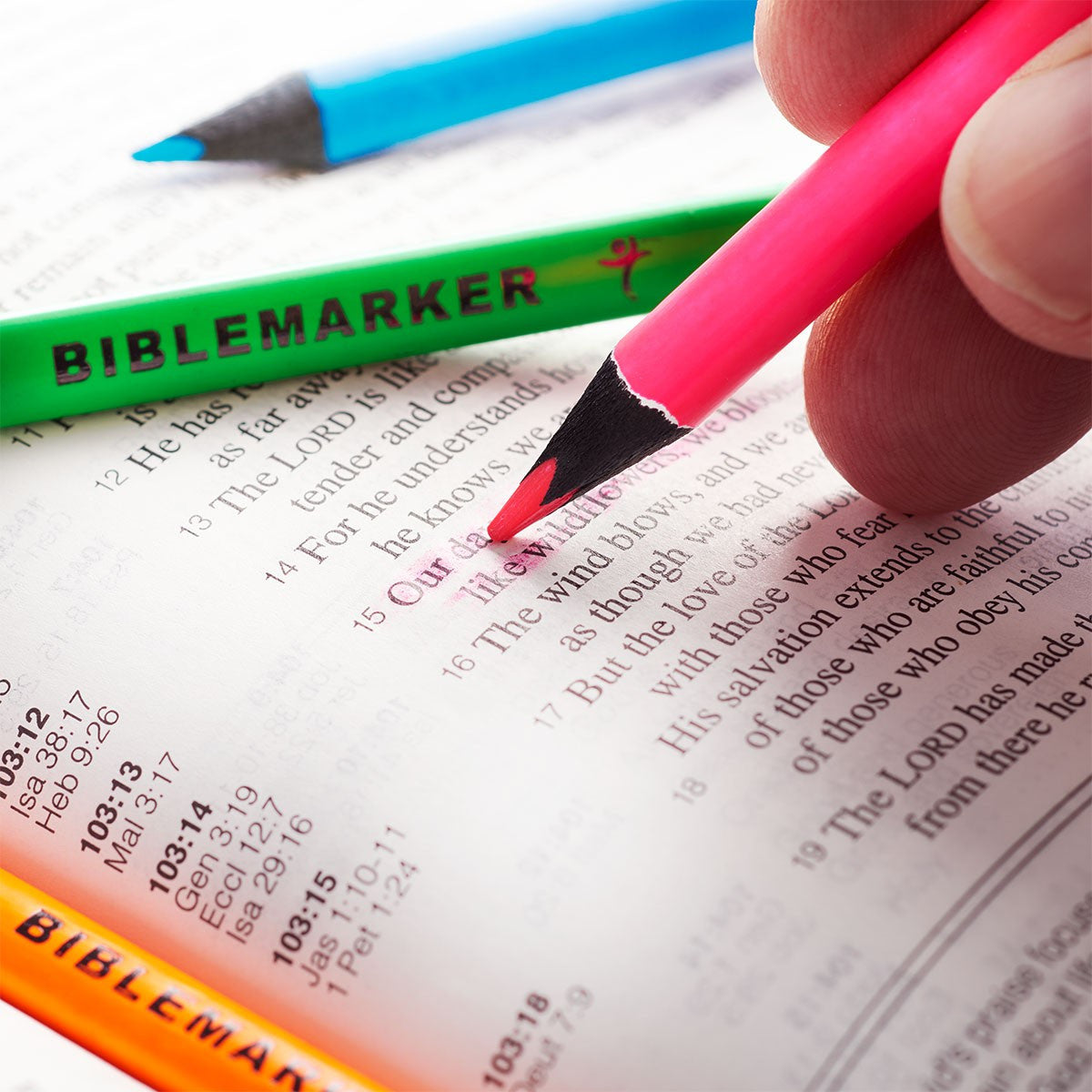 Bible markers with colorful pens on a Bible page