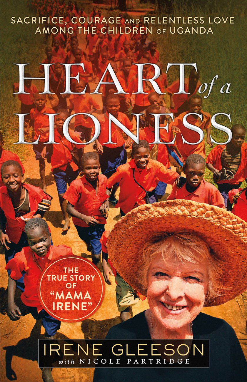 Book cover of 'Heart of a Lioness' featuring children in red shirts and a woman with a hat.
