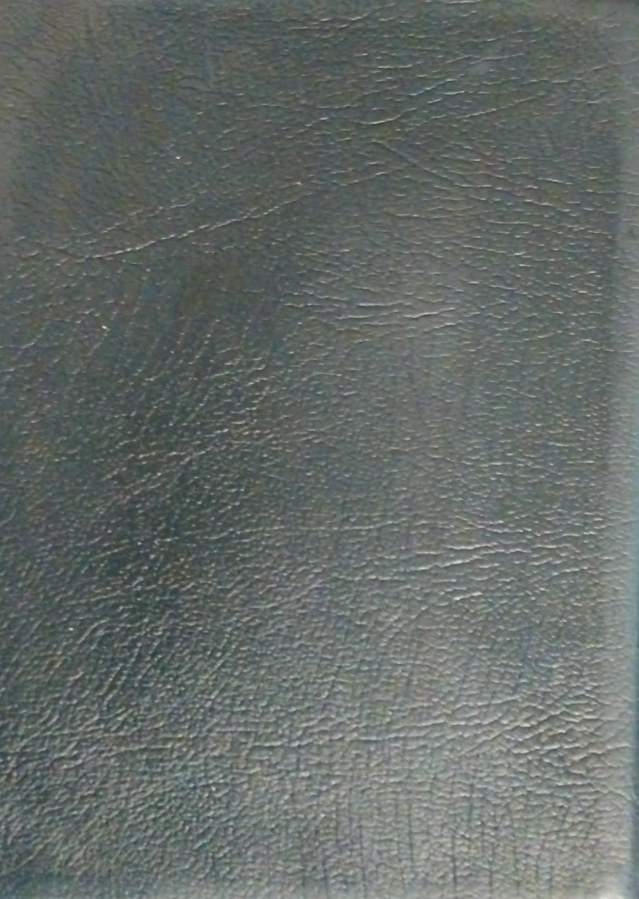 A dark gray textured faux-leather notebook or binder cover lying on a brown wooden surface.