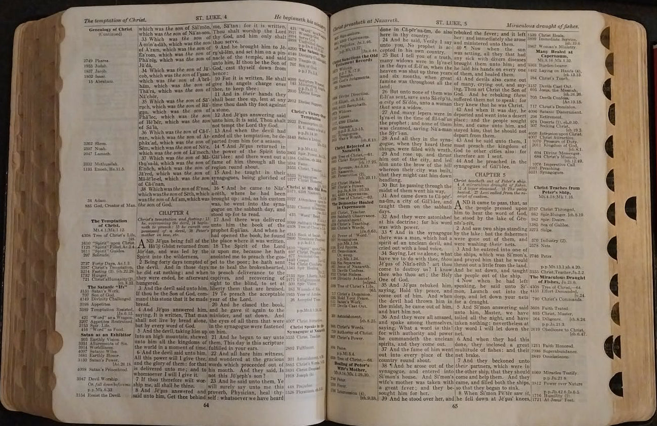 Open book with text on a dark surface