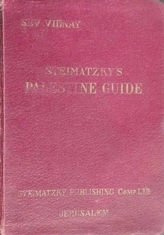 Red book with gold text on a dark surface