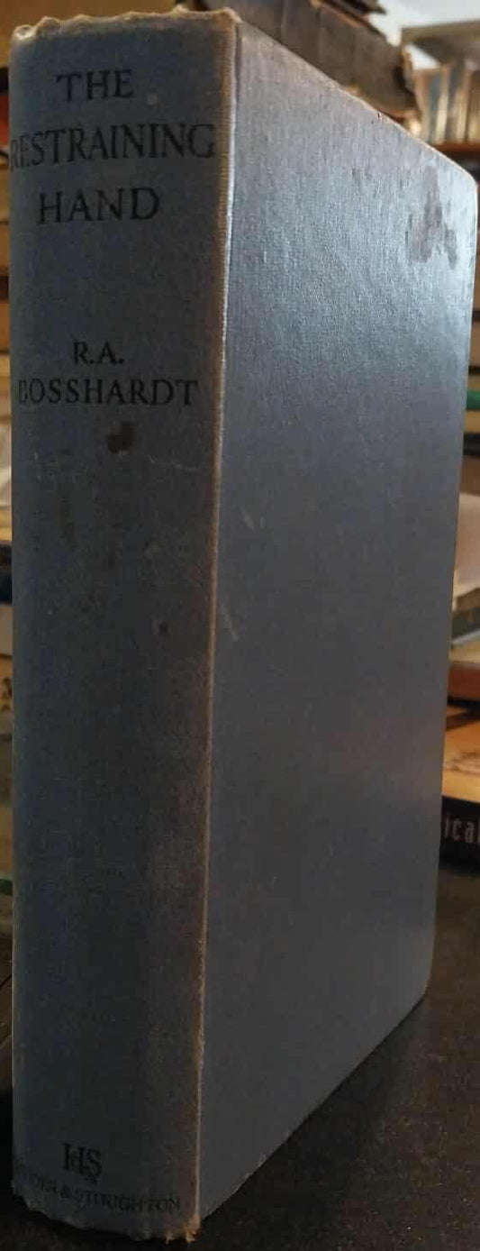 Book titled 'The Straining Hand' by R.A. Lonsdale on a shelf with other books.