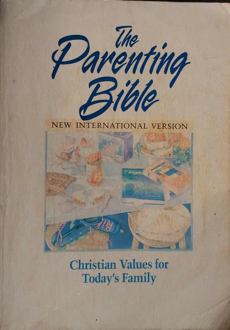 Book titled 'The Parenting Bible' with images of children and family on the cover.