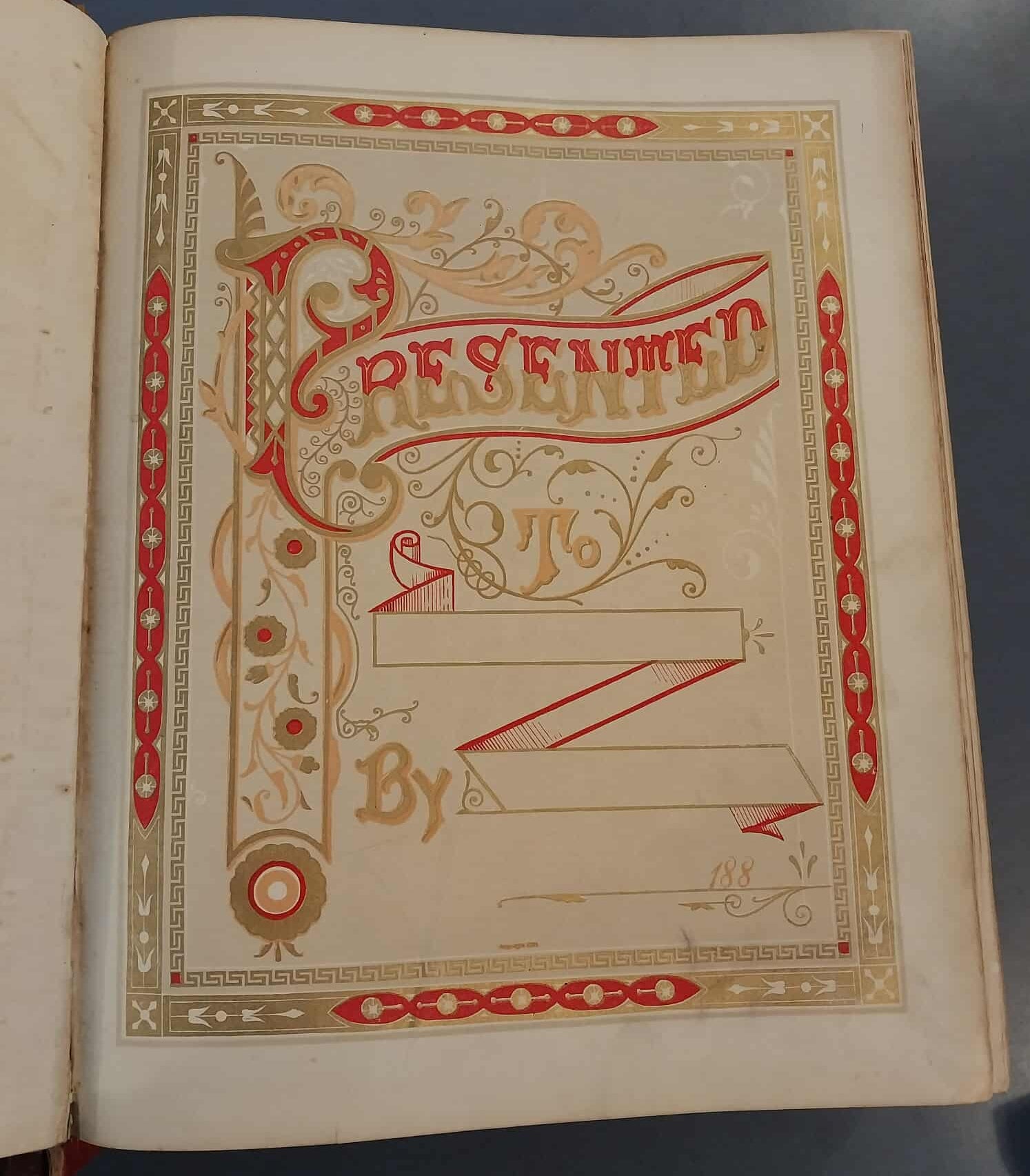 Decorative page from an old book with intricate designs and text.