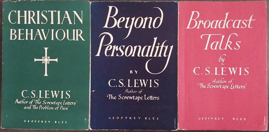 Three books by C.S. Lewis stacked on a dark surface