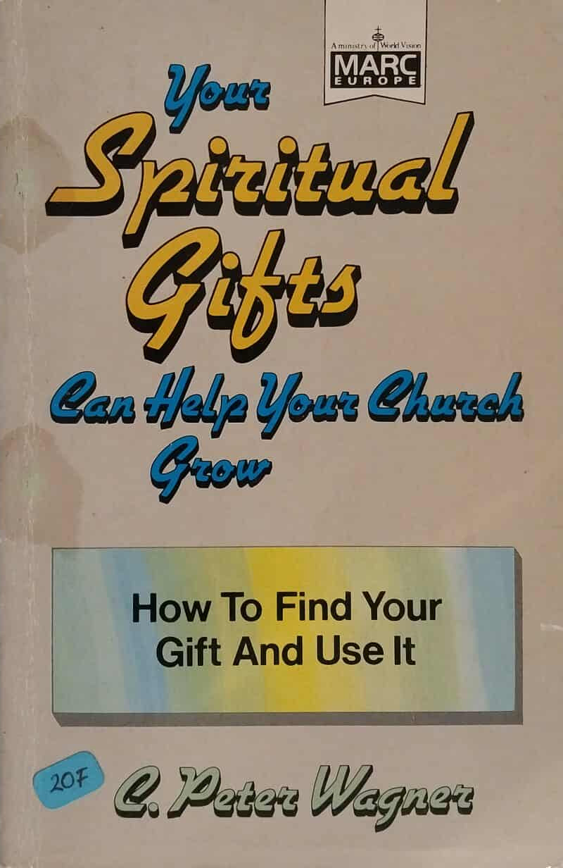 Book cover of 'Your Spiritual Gifts Can Help Your Church Grow' by C. Peter Wagner on a dark surface.