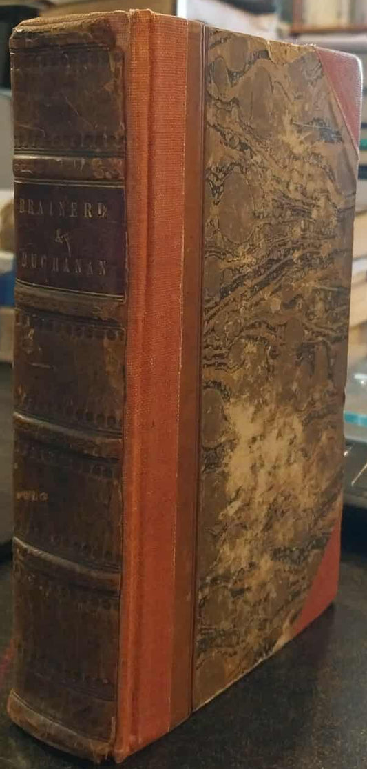Vintage book with worn leather binding on a shelf
