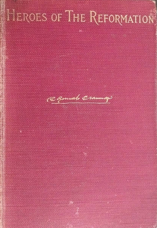 Red book titled 'Heroes of the Reformation' on a dark surface