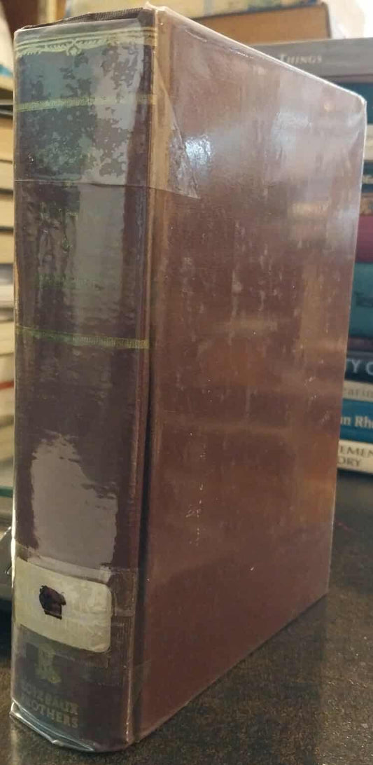 Stack of books with a prominent brown book on top