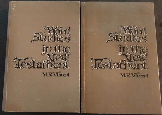 Two leather-bound books titled 'The World of Joseph' on a dark surface.