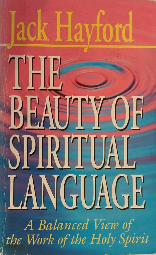 Book titled 'The Beauty of Spiritual Language' by Jack Hayford on a surface with another book in the background.