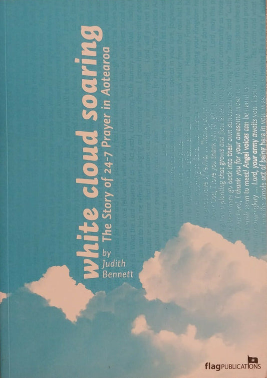 Book titled 'White Cloud Soaring' on a brown surface