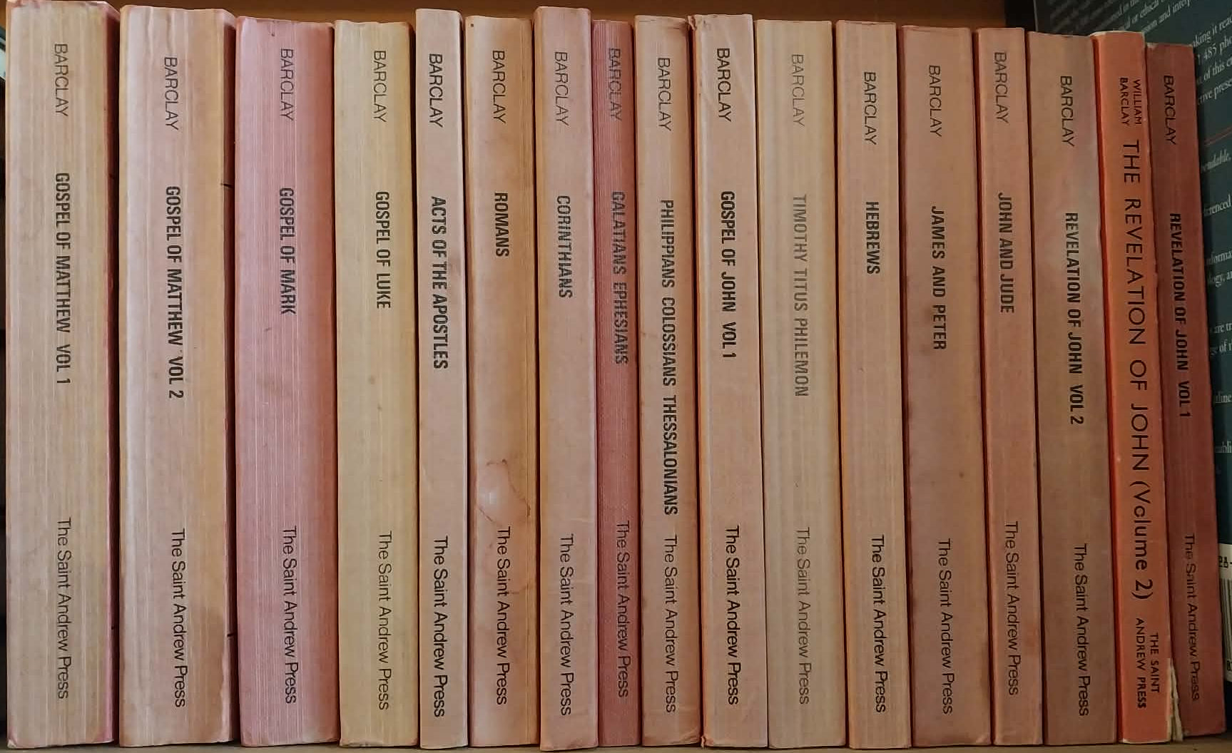 Row of books on a shelf with visible spines