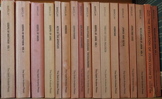 Row of books on a shelf with visible spines