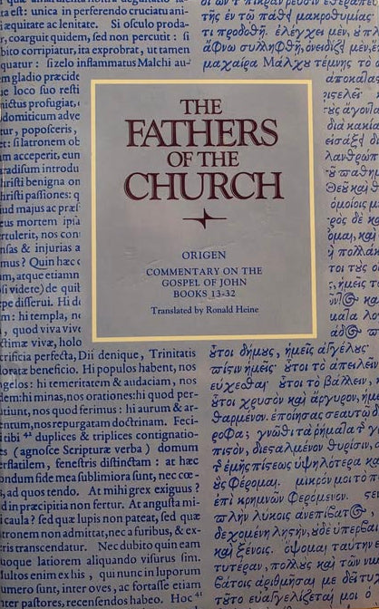 Book titled 'The Fathers of the Church' with a blue and white cover