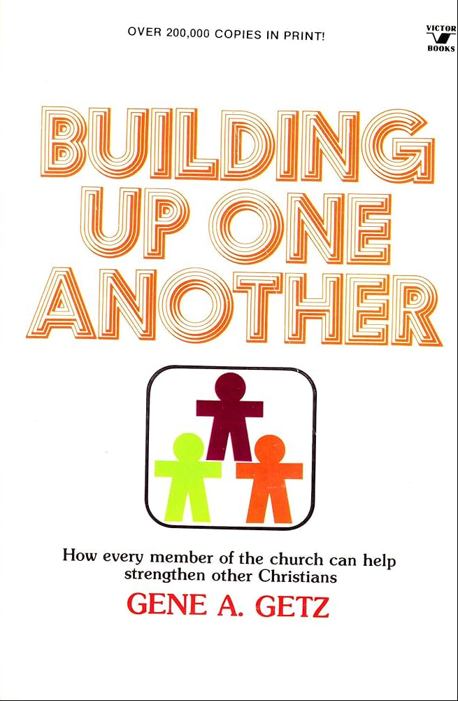 Book cover of 'Building Up One Another' by Gene A. Getz with colorful figures on a white background.