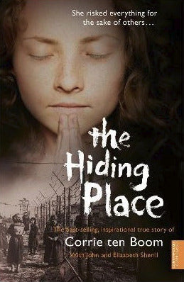 Book cover of 'The Hiding Place' by Corrie ten Boom with a woman's face and historical background.