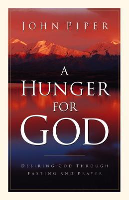 Book cover of 'A Hunger for God' by John Piper with a mountain landscape.
