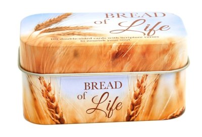 A square metal tin with rounded corners, featuring a wheat field design and the text 'BREAD of Life' on the lid and front, isolated on a white background.