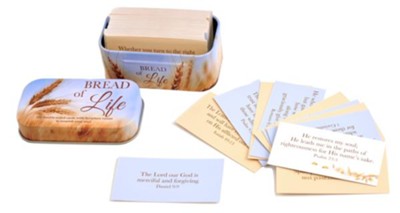 Bread of Life prayer cards and matching tin box on a white background. The set includes a rectangular tin with a wheat design and the words 'BREAD of Life,' several cream prayer cards, and a few light blue cards with Bible verses printed on them.