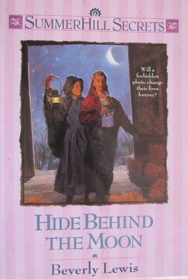 Book cover for 'Hide Behind the Moon' by Beverly Lewis, part of the SummerHill Secrets series. The cover is light pink with a central illustration of two women in historical dress under a crescent moon, and the title is printed in blue text at the bottom.