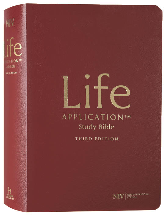 Red Life Application Study Bible with gold text on a white background