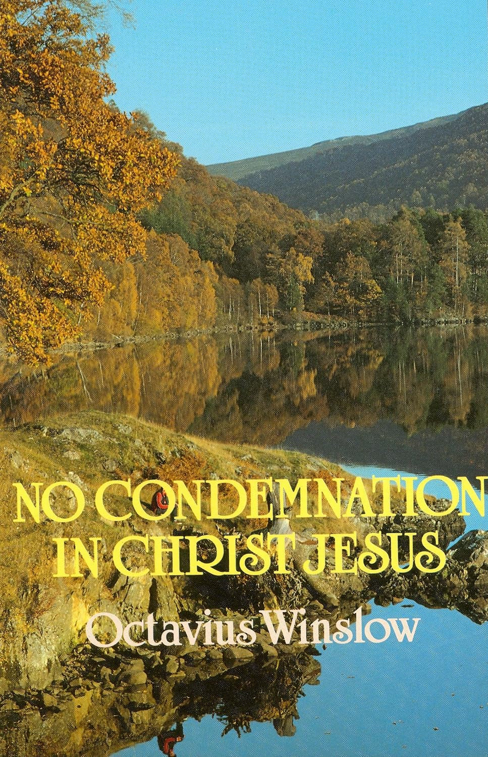 A book cover featuring a scenic autumn landscape with yellow foliage, a calm reflective lake, and blue sky. Large yellow text reads 'NO CONDEMNATION IN CHRIST JESUS' and the author name 'Octavius Winslow' appears in white near the bottom.