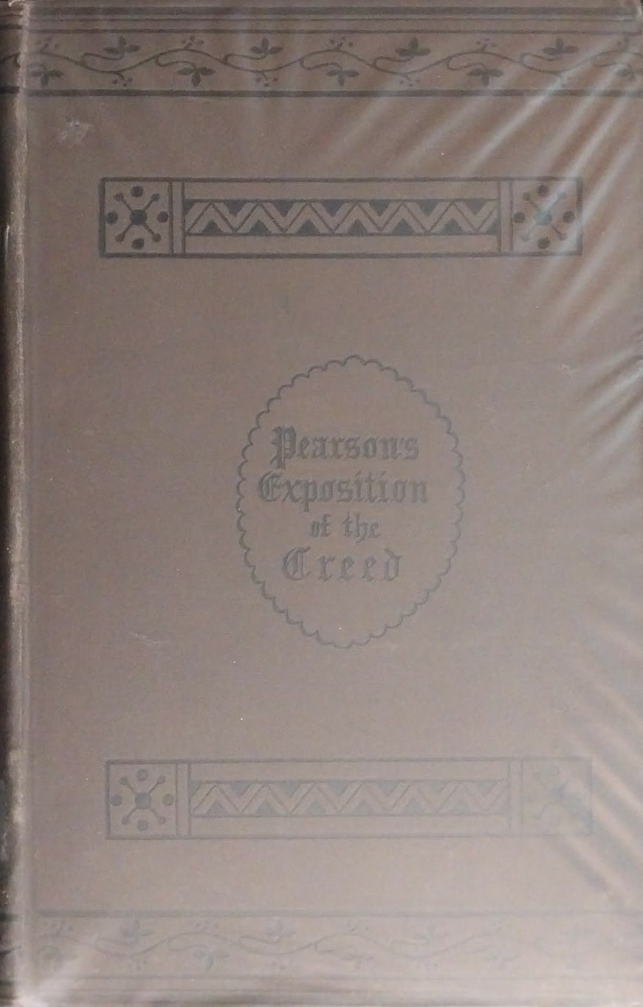 Decorative book with intricate design on a dark surface
