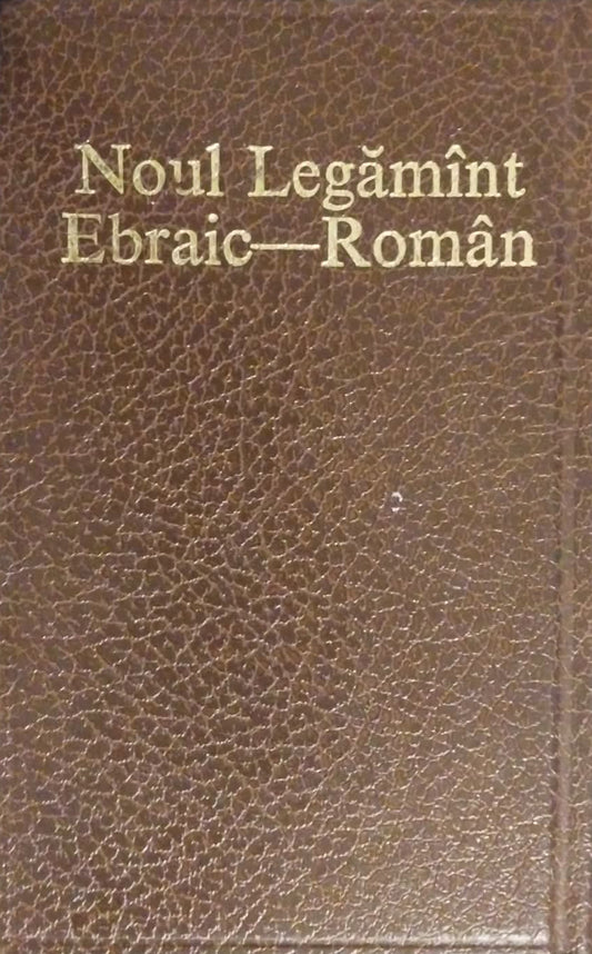 A brown textured book or booklet cover with gold lettering reading 'Noul Legămint Ebraic-Romană', photographed against a dark gray surface.