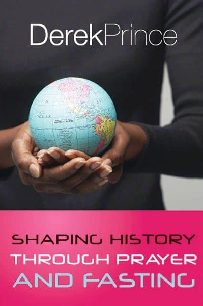 Person holding a small world globe with 'Derek Prince' and 'Shaping History Through Prayer and Fasting' text.