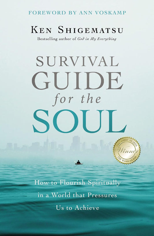 Book cover for 'Survival Guide for the Soul' by Ken Shigematsu, featuring a serene teal and blue seascape with a small boat and a gold award seal on a pale background.
