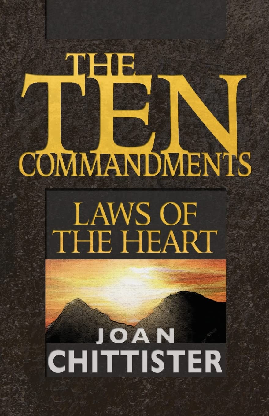 Book cover for 'The Ten Commandments: Laws of the Heart' by Joan Chittister, featuring large gold title text on a dark textured background with a sunset mountain illustration and white author text.