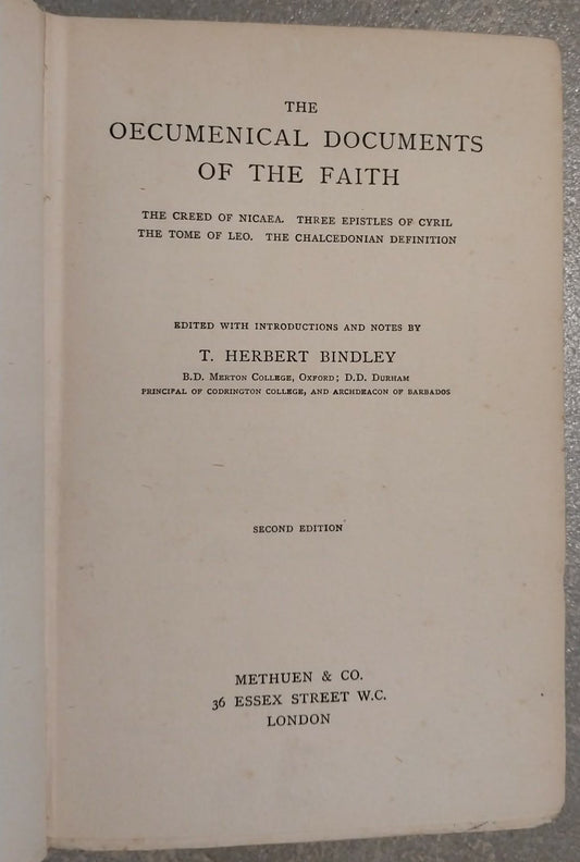 An open vintage book showing the title page of 'The Oecumenical Documents of the Faith' with printed text on aged cream paper, photographed against a textured gray background.