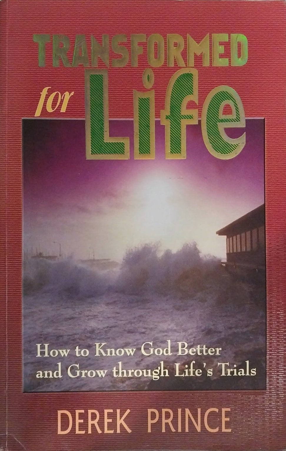Book titled 'Transformed for Life' by Derek Prince on a dark background