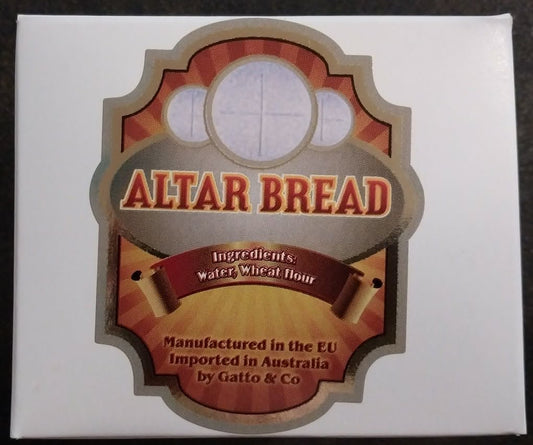 Box of Altar Bread with decorative label on a dark background
