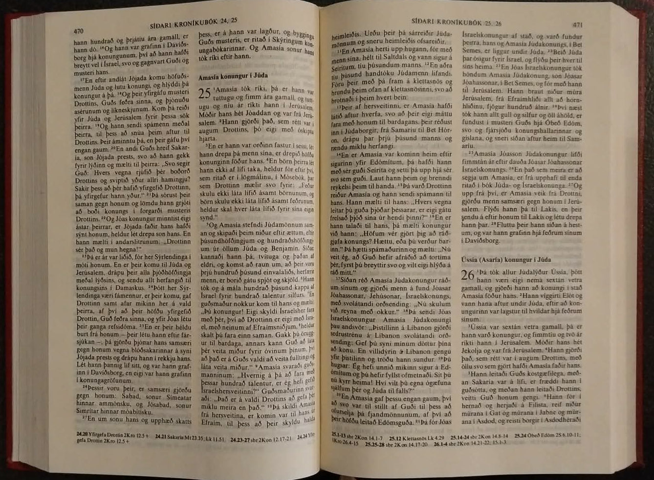 An open book with dense printed text, photographed from above on a dark surface. A blue and white Swatch eraser is visible at the top edge.