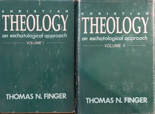 Two books titled 'Theology' by Thomas N. Finger on a wooden surface.