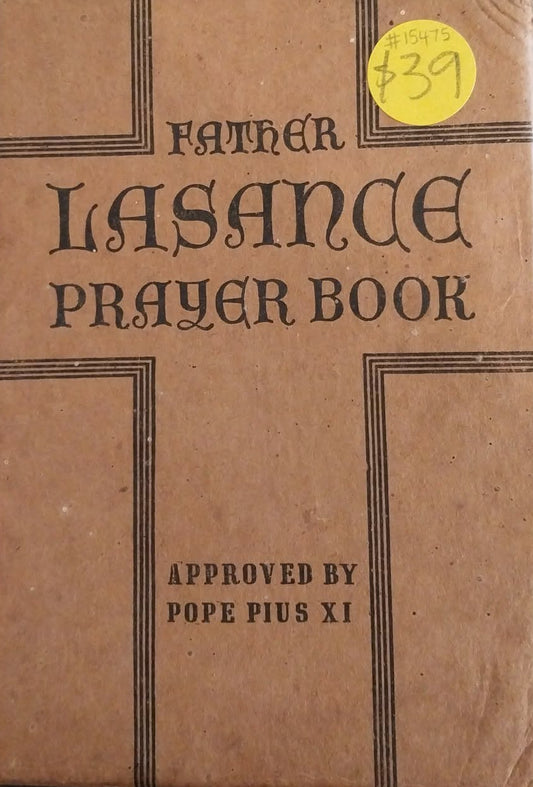 Brown prayer book titled 'Father Lasance Prayer Book' with a yellow price tag on a dark surface.