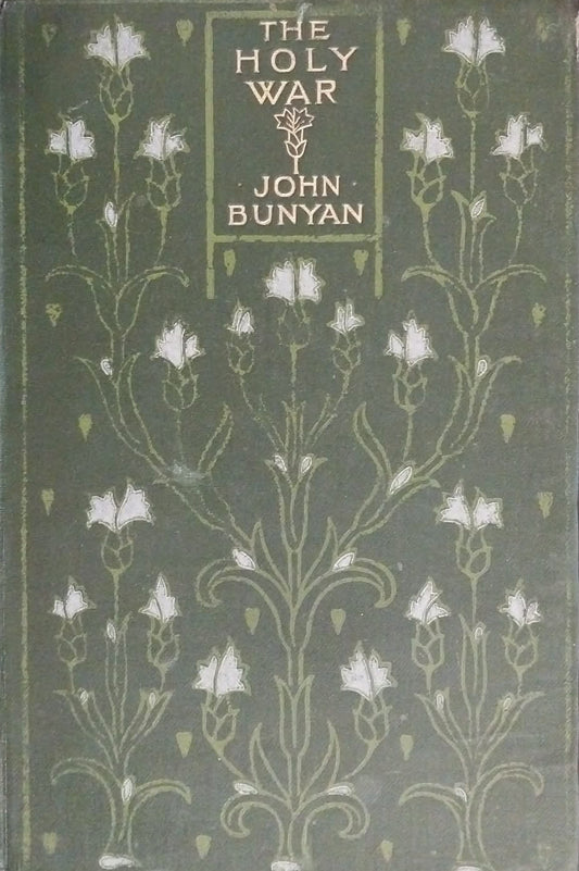 Vintage hardcover book of 'The Holy War' by John Bunyan, featuring a dark olive green cover with white floral illustrations and gold lettering, resting on a dark brown textured surface.