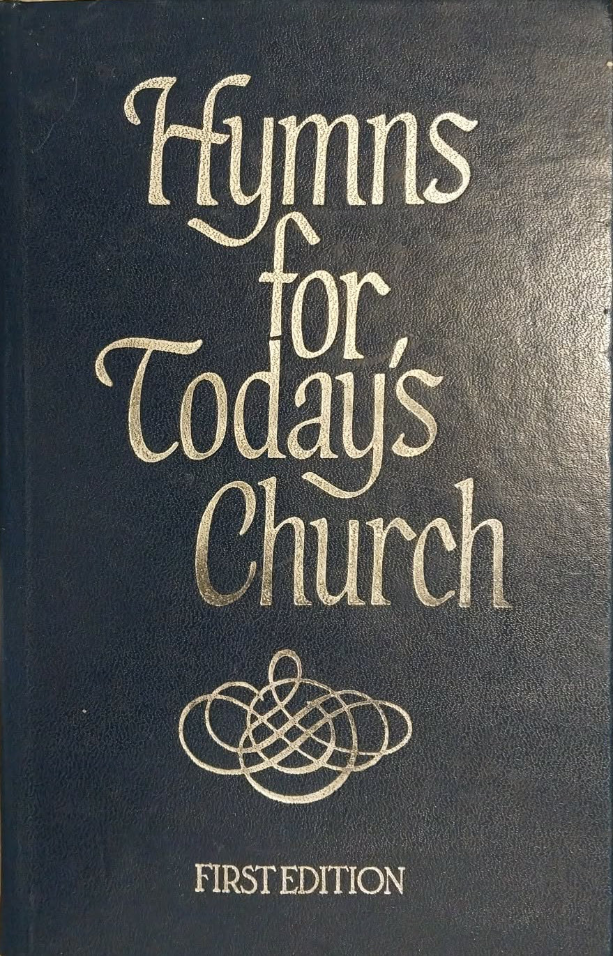 A dark blue hymnal book titled 'Hymns for Today's Church' with silver lettering, placed on a light beige surface.