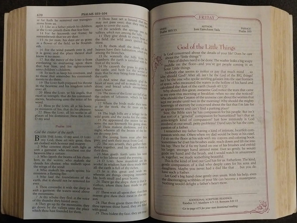 An open book with cream-colored pages and dense printed text, photographed from above on a dark surface.