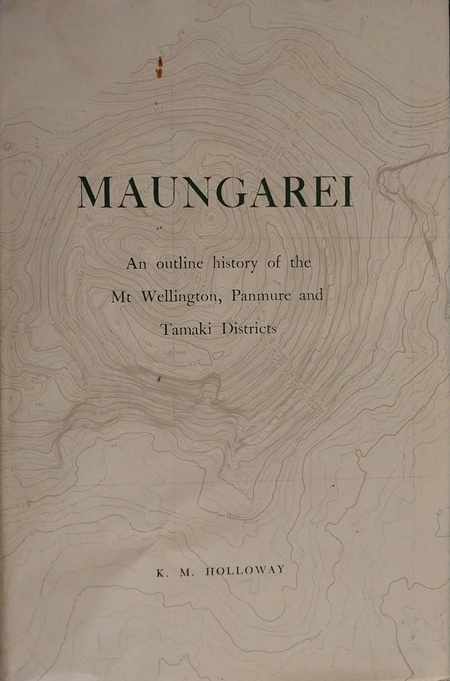 Book titled 'Maungarei' with a topographic map design on the cover, on a dark background.