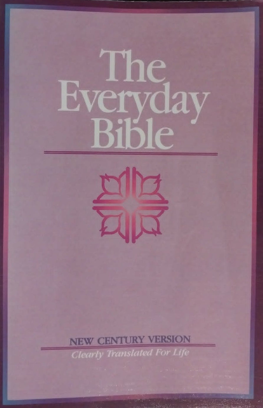 Pink cover of 'The Everyday Bible' with a star design on a dark background
