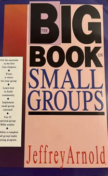 Book titled 'The Big Book on Small Groups' by Jeffrey Arnold with a pink and orange cover.