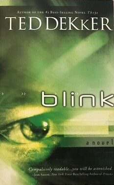 The front cover of the novel 'Blink' by Ted Dekker, featuring a green-toned close-up of a human eye and the title 'blink' in large white letters.