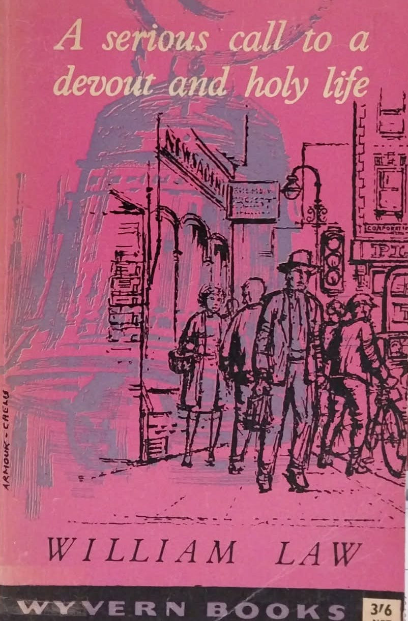 Vintage paperback book titled "A serious call to a devout and holy life" by William Law, published by Wyvern Books. The cover is pink with a black line-art illustration of a street scene and cream-colored text.